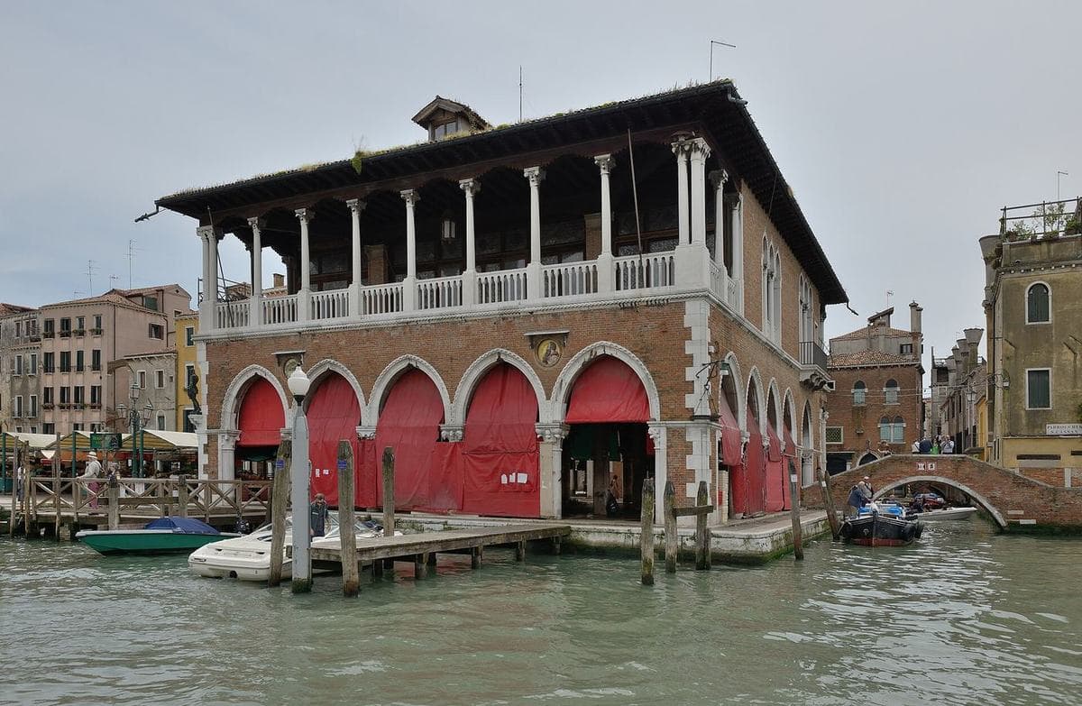 The arcaded Pescheria fish market on the Grand Canal at Rialto